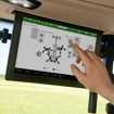 Bildausschnitt aus der Fahrerkabine mit Sicht auf den Fendt Monitor