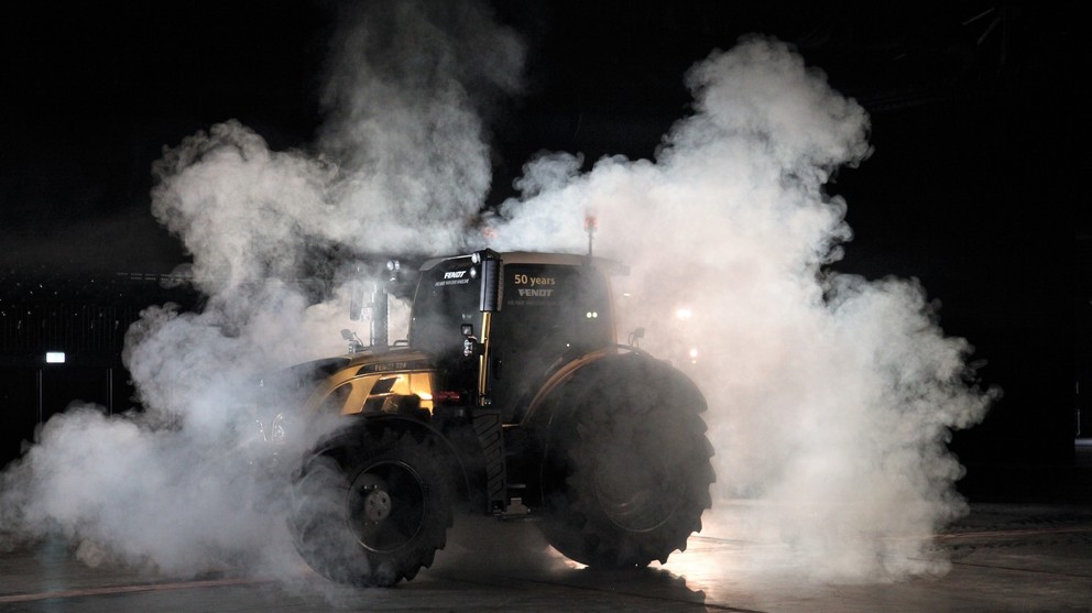 Golden tractor with smoke