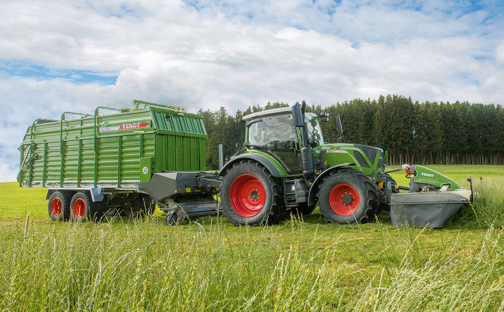 Fendt tractor with mower and loader wagon