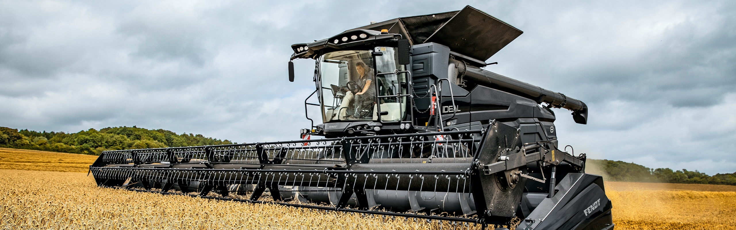 A farmer driving the Fendt IDEAL in the field