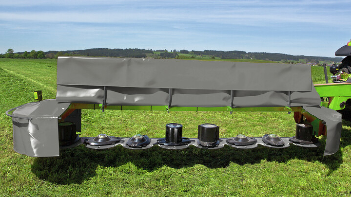 Full cloth front protectors Close-up of the mower with the full fabric front guard folded up.