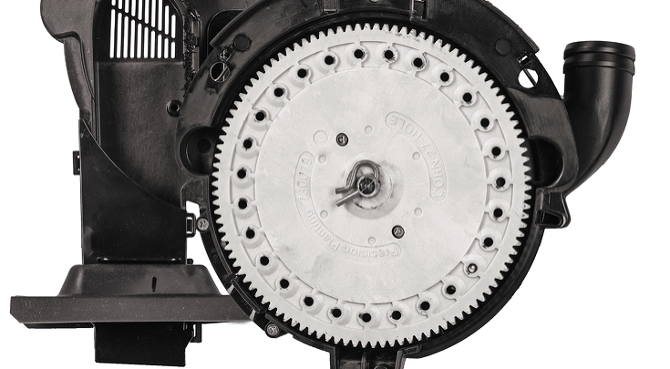 vSet: Precise single seed placement with easy maintenance Mechanical component of an agricultural device with a large, circular gear wheel featuring evenly spaced openings.