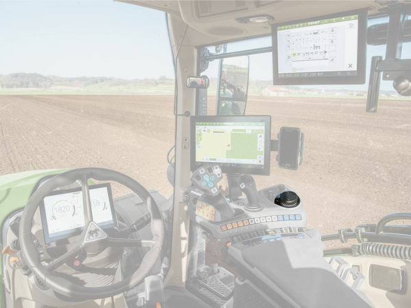 Primer plano de la cabina del Fendt 700 Vario Gen6, donde se destaca en color la ruleta de selección.