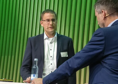 Shrimp farmer Sven Damm spoke on stage at the Fendt Sustainability Forum about the challenges of repurposing former pigsties