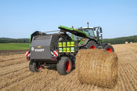 View under the flap of the Fendt Rotana round baler showing the storage space for the 8 rolls of twine.