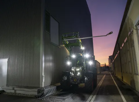 Fendt tractor with champagne bottle installed on front loader