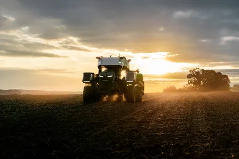 Fendt Xaver GT with the sunset behind it