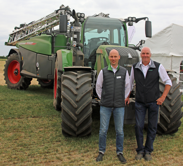 Fendt employees Jochen Buhrmester (left) and Thomas Fischer (right) on the Rogator 300 trailed sprayer.