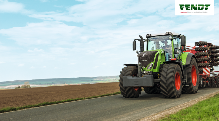 Fendt 800 Vario drives with sowing machine on the road.