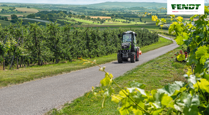 Fendt 200 V Vario drives on the road through the vineyards.