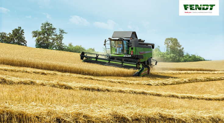 A Fendt L-Series combine threshing in a straw field.