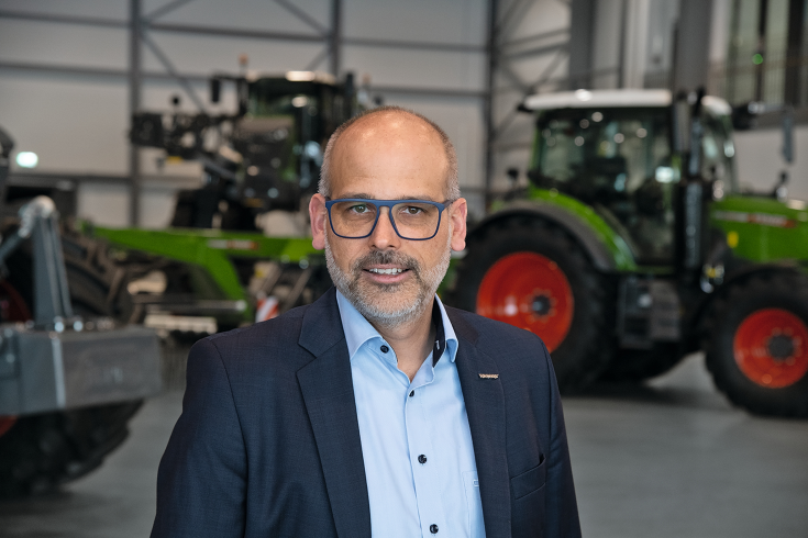 Christian Erkens (Director Fendt Sales for the EME region) in the backround Fendt machinery