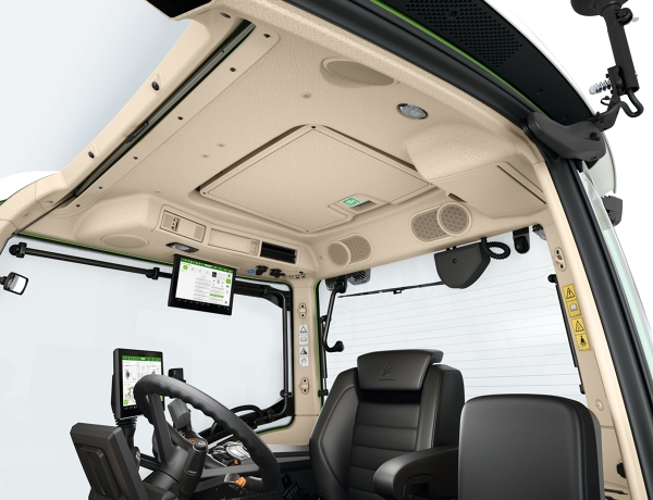 Interior view of the cab of a tractor with a view of its equipment.