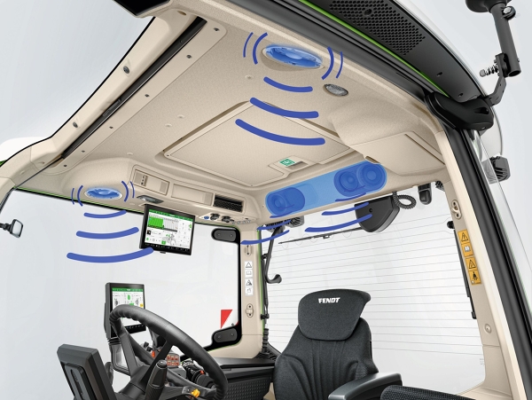 Interior view of a tractor cab. The entertainment system has been graphically emphasised with blue markings.