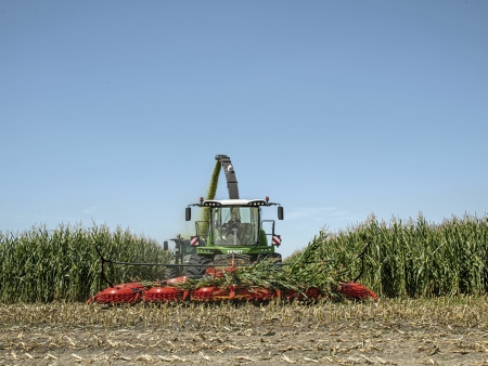 The Fendt Katana forage harvester driving out of a maize field