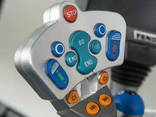 Close-up of the optional professional joystick in the Fendt 900 Vario MT with additional buttons for controlling two hydraulic valves, in an "ergonomic design