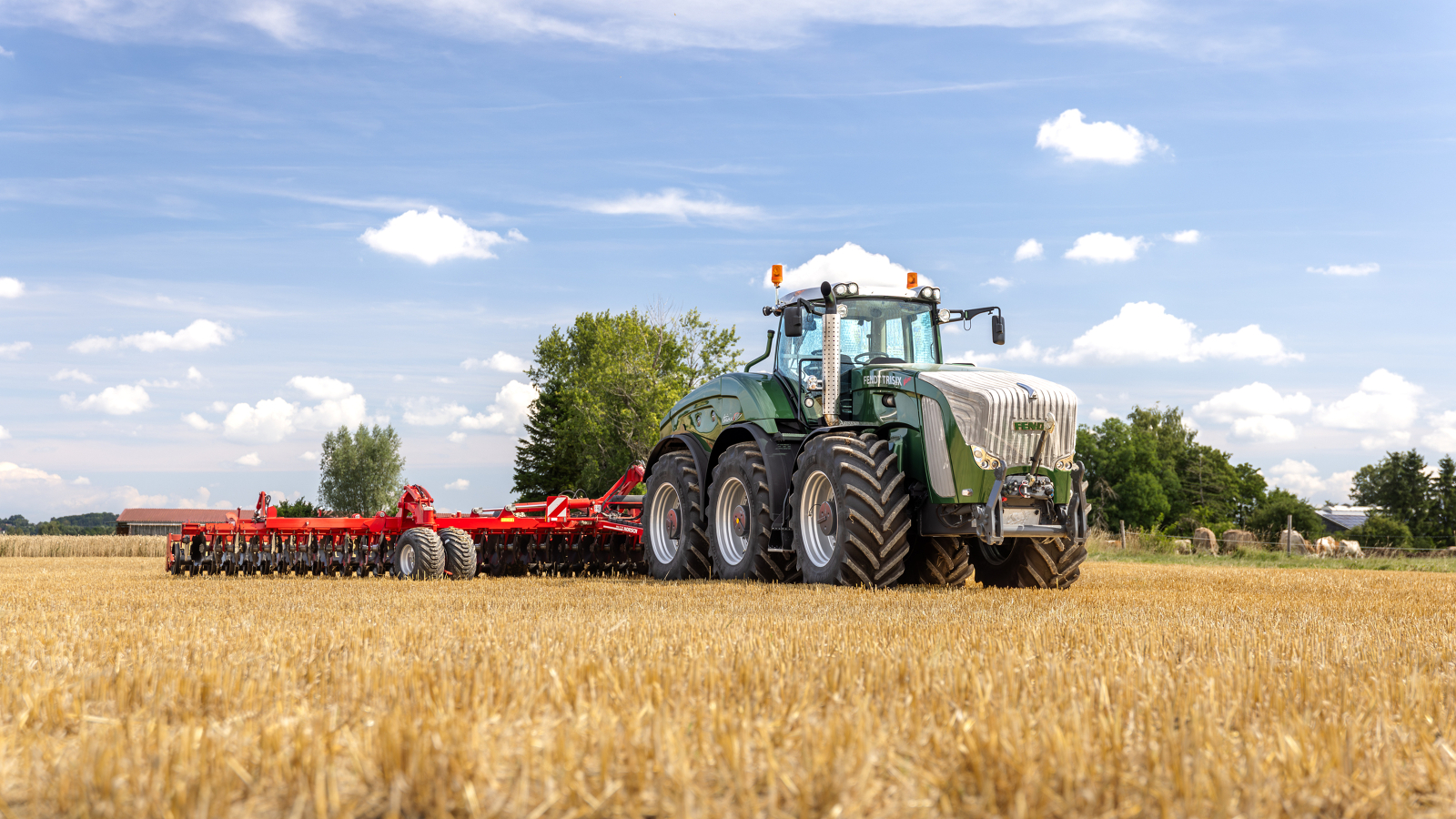 Fendt Trisix A farmer driving a Fendt Trisix in a field.