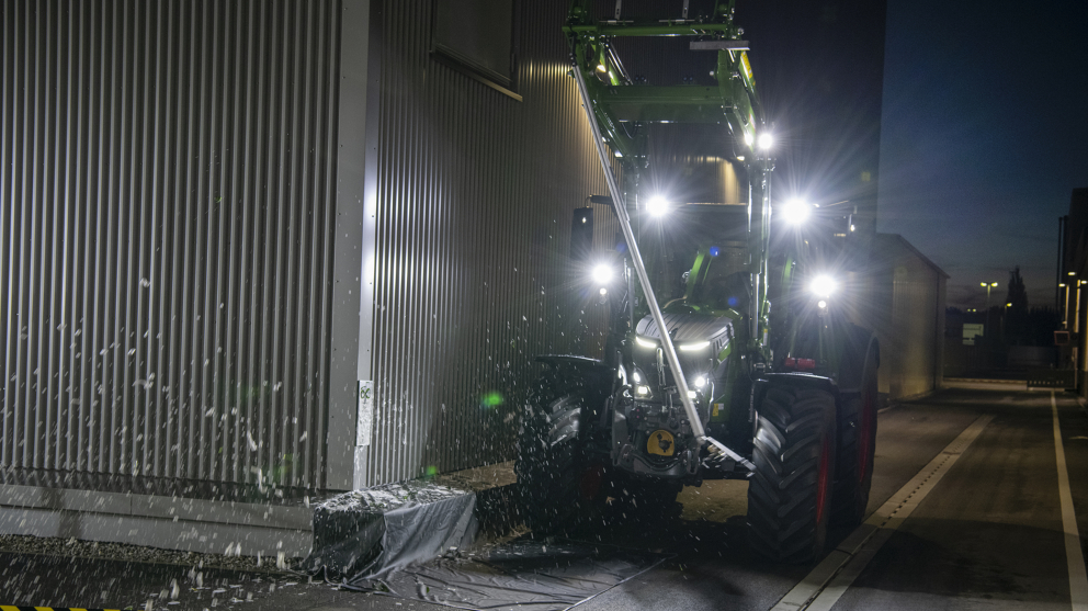 Fendt tractor with champagne bottle installed on front loader