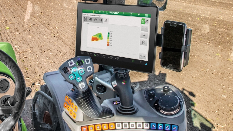 Close-up of the multifunction armrest with terminal in a Fendt tractor