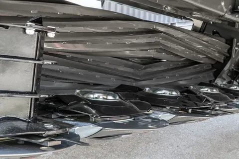 View under the Fendt Slicer mower with steel rollers
