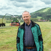 Mr Toralf Müller stands in front of a Fendt Katana