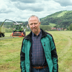 Mr Toralf Müller stands in front of a Fendt Katana