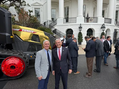 Eric Hansotia at the White House beside the Golden Fendt Tractor