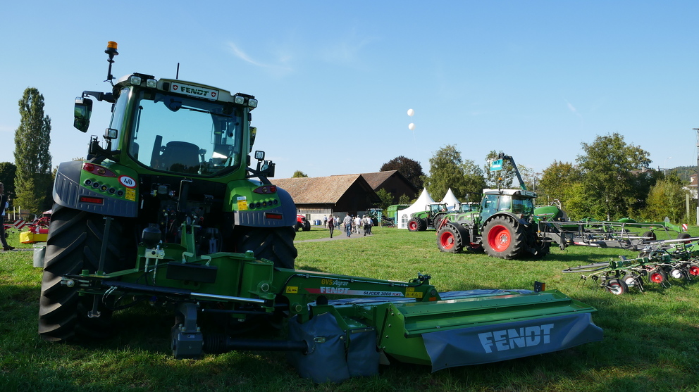 Exhibition of tractors in a field