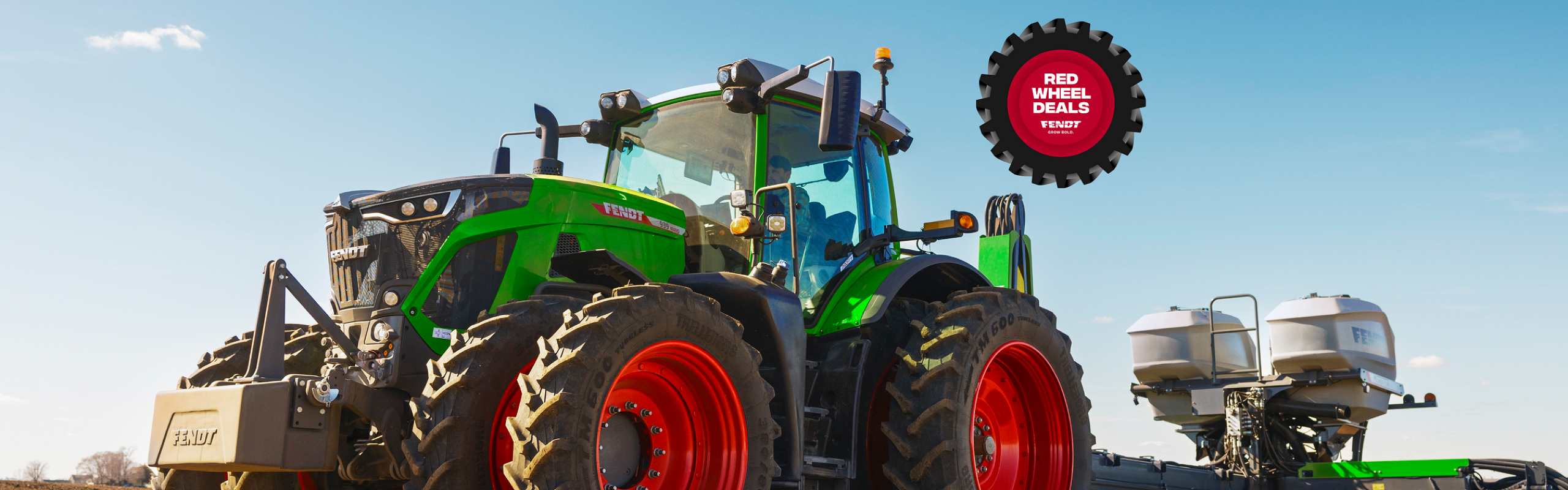 Fendt 900 Vario Tractor pulling a Fendt Momentum Planterr in the field