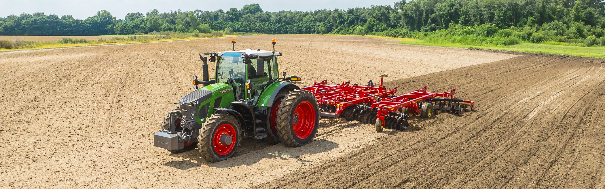 Fendt 600 Tractor pulling tillage in a field