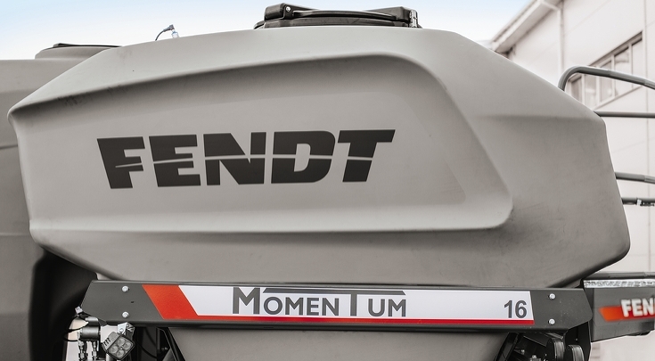 Close-up of the Fendt MOMENTUM machine with focus on one of the seed hoppers, labelled ‘FENDT’ and ‘MOMENTUM 16’.