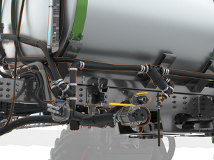 Detailed view of the lower section of an industrial tank system with multiple hoses, pipes and connections for liquid circulation.