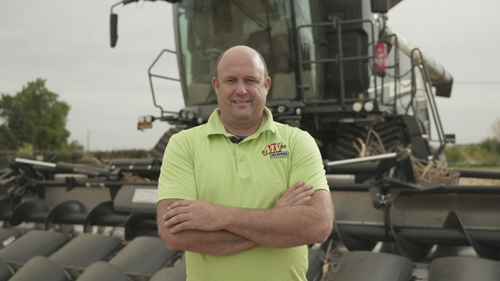 Farmer standing in front of Fendt Ideal Combine