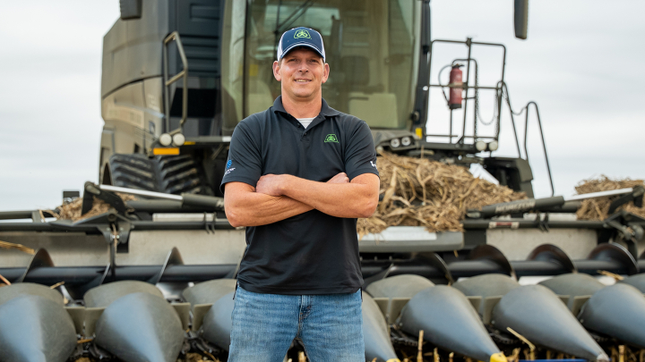 Farmer stands in front of the Fendt IDEAL Combine