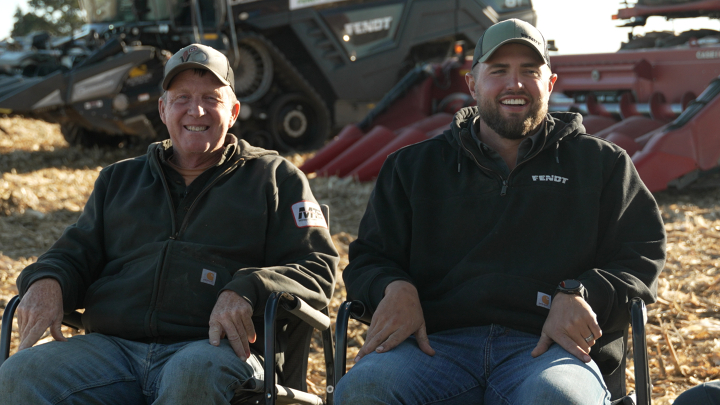two farmers sit in chairs in front of the Fendt IDEAL combine two farmers sit in chairs in front of the Fendt IDEAL combine