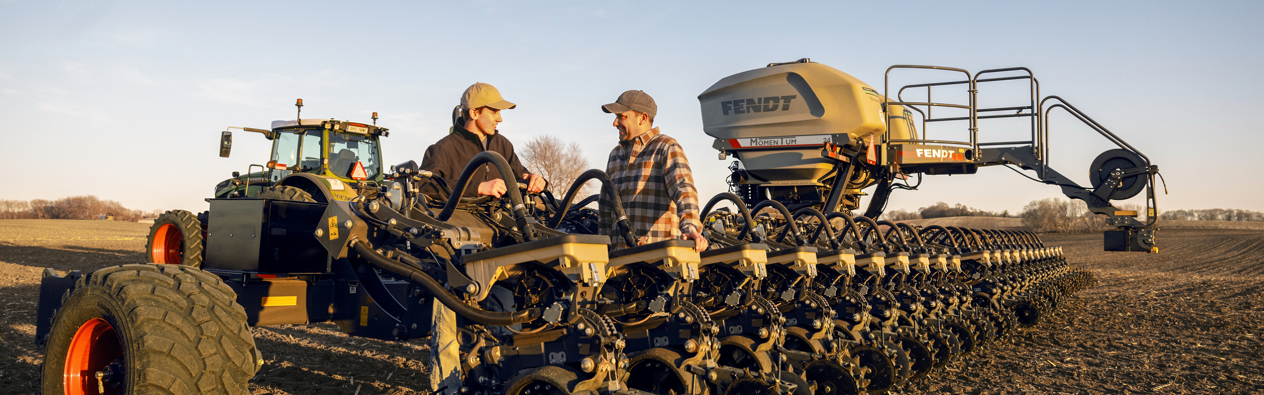 Father and Son working together on the farm with their Fendt tractor and Momentum planter in the field