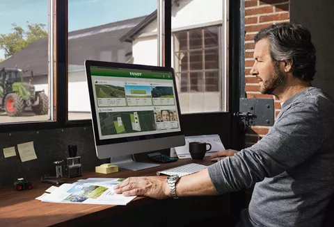 Farmer sits in front of the computer