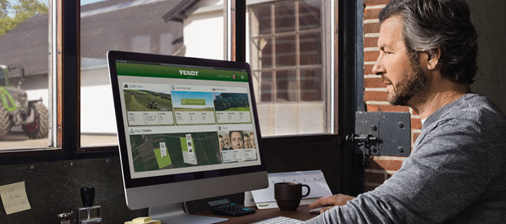 Farmer sits in front of the PC